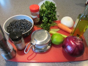 Ingredients for black bean salad:  dried black beans, carrot, celery, thyme, parsley, bay leaf, onion, olive oil, lime juice, red onion, cilantro, cumin, chili powder, Kosher salt, and black pepper.