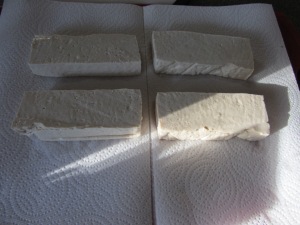 Block of firm tofu, cut into four fillets.