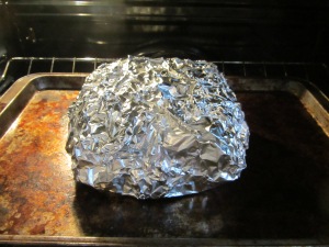 The roast packet, sealed in two layers of foil and put in the oven for 3.5 hours.