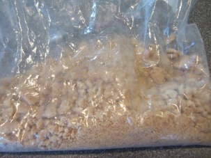 Crushed graham cracker squares - mix of crumbs and larger pieces.