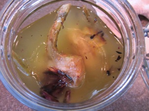 Herb oil, poured over broiled chokes.