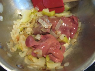 Livers added to the pan.