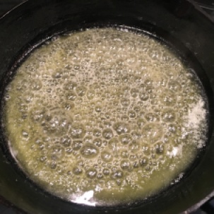 Melted butter brushed up sides of pan.
