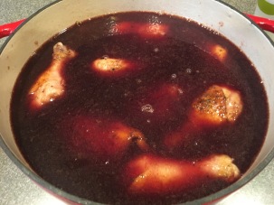 Chicken broth and remaining wine added to chicken and Dutch oven placed in refrigerator overnight.