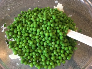 Cheese and peas added to dressing.