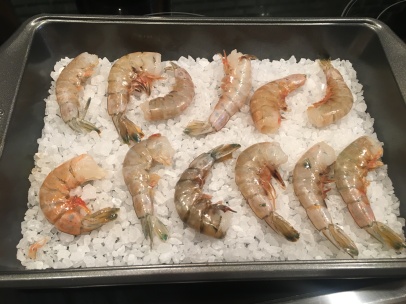 Shrimp placed on top of hot salt in 9x13" pan.