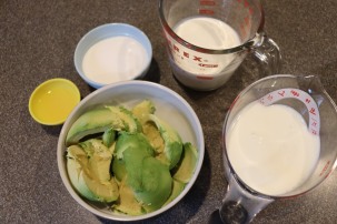Ingredients for avocado ice cream: avocado, lemon juice, sugar, heavy cream, and whole milk.