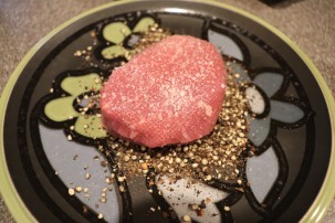 Filets (the right filet is the larger butterflied one) seasoned with Kosher salt and pressed into coarse black pepper.