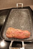 Roast placed on salted grill pan.