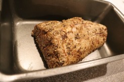 Seared roast placed in metal pan.