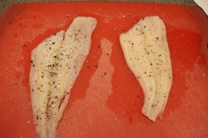 Flounder fillets, seasoned with Kosher salt and pepper.